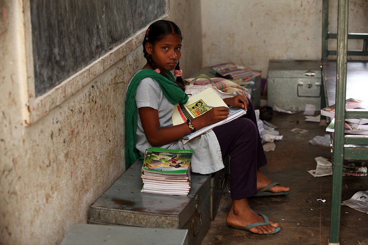 A young girl with books