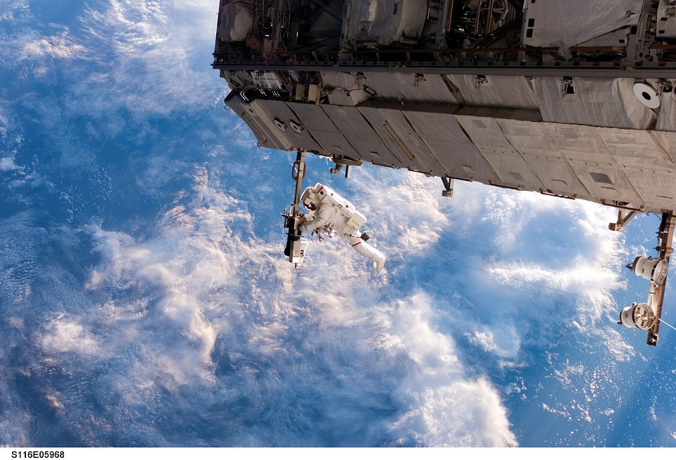 Astronaut on spacewalk by ISS